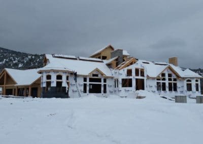 under construction house covered with snow