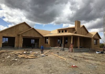 men working at under construction house